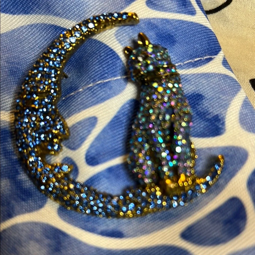 BETSEY Johnson’s Sparkling Blue and Gold Cat Brooch